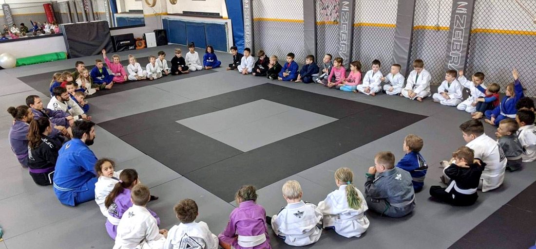 Large circle of children in their gi.